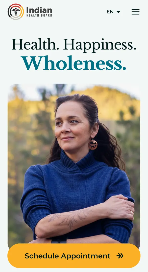 Mobile homepage hero, “Health. Happiness. Wholeness.,” with a Schedule Appointment button.